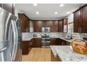 Modern kitchen featuring stainless steel appliances, granite countertops and ample cabinet space at 1221 Fountain Head Ct, Lawrenceville, GA 30043