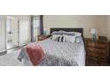 Comfortable main bedroom with ensuite bathroom and natural light at 1221 Fountain Head Ct, Lawrenceville, GA 30043