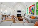 Bright living room with vaulted ceilings, fireplace, and contemporary furnishings at 35 Kenmare Hall Ne, Atlanta, GA 30324
