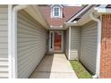 Close-up of the home's entrance showing siding and brick details leading to the front door at 4016 Meadow Glen Way, Fairburn, GA 30213