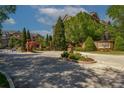 Inviting entrance to Sterling of Dunwoody with manicured grounds and brick signage at 2300 Peachford Rd # 3411, Dunwoody, GA 30338