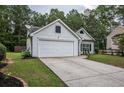 Well-maintained home featuring an attached two car garage and an expansive driveway at 7113 Silver Mine Xing, Austell, GA 30168