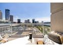 Outdoor balcony featuring comfortable seating with stunning cityscape views at 285 Centennial Olympic Park Nw Dr # Ph2-7, Atlanta, GA 30313