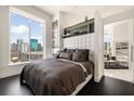 Comfortable bedroom with city views, and an en-suite bathroom at 285 Centennial Olympic Park Nw Dr # Ph2-7, Atlanta, GA 30313