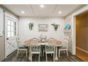 Bright dining area with rustic farmhouse decor, modern lighting, and stylish shiplap accent wall at 315 Charlotte Blvd, Stockbridge, GA 30281
