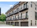 Luxury townhome with private balconies, garages, and brick facade at 574 Boulevard Ne Pl # 4, Atlanta, GA 30308