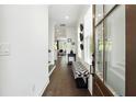 Inviting entryway with hardwood floors, white walls, and a stylish bench, creating a warm and welcoming atmosphere at 116 Birch Tree Way, Cumming, GA 30040