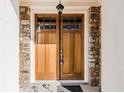 Stunning double front door with glass panels and stone surround offers an inviting entrance at 1435 Druid Manor, Atlanta, GA 30329