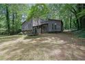 Attractive angle of the home showcases a cozy, covered entrance and natural surroundings at 361 Gordon Valley Sw Ln, Mableton, GA 30126