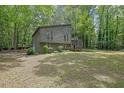 Inviting front view of the property with well-maintained landscaping and a sense of privacy at 361 Gordon Valley Sw Ln, Mableton, GA 30126