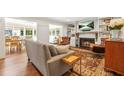 Cozy living room with a fireplace, built-in shelves, and comfortable seating at 3870 Windhurst Dr, Lilburn, GA 30047
