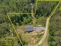 Overhead view of property and surrounding area showing lot lines, trees and private driveway at 212 Postell Rd, Dallas, GA 30157