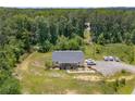 Birds eye view of home and surrounding area showing the driveway and landscaping at 212 Postell Rd, Dallas, GA 30157