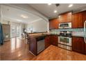 Stylish kitchen featuring wood cabinetry, stainless steel appliances, and an open layout at 2277 Peachtree Ne Rd # 611, Atlanta, GA 30309