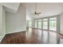 Spacious living room featuring vaulted ceilings and an abundance of natural light, perfect for gatherings at 616 Lone Oak Ct, Lithonia, GA 30058