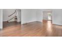 Open-concept living room with hardwood floors and freshly painted white walls at 2592 River Oak Dr, Decatur, GA 30033