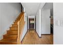 Hallway features hardwood flooring and wooden stairs at 475 Shadetree Ln, Lawrenceville, GA 30044