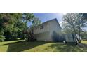 A nice view of a back yard with an elevated deck on a sunny day at 279 Fairview Dr, Dallas, GA 30157