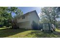 A nice view of a back yard with an elevated deck on a sunny day at 279 Fairview Dr, Dallas, GA 30157