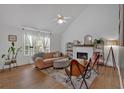 Inviting living room featuring high ceilings, a fireplace, neutral paint, and stylish furnishings at 4053 Five Oaks Ct, Powder Springs, GA 30127