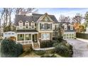 Inviting two-story home featuring a cozy front porch, manicured landscaping, and attached two-car garage at 192 Chicopee Dr, Marietta, GA 30060