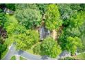 Lush aerial view showcasing the home nestled amongst mature trees in a serene neighborhood setting at 1220 Wade Green Nw Cir, Acworth, GA 30102