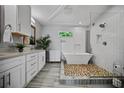 Bright bathroom with a freestanding tub, walk-in shower, and modern fixtures at 670 Parker Ave, Decatur, GA 30032