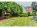 Well-maintained backyard with green grass and lush landscaping at 3499 Paces Ferry Se Cir, Smyrna, GA 30080