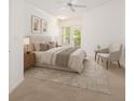 Serene bedroom with a large window, plush bedding, and a cozy seating area at 1850 Cotillion Dr # 4218, Atlanta, GA 30338
