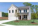 Beautiful two-story home boasting a white brick facade, lush lawn, and an attached two-car garage at 608 Belshire Dr, Acworth, GA 30102