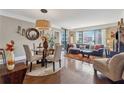 Inviting living room and dining area with hardwood floors and large windows at 3481 Lakeside Ne Dr # 1103, Atlanta, GA 30326
