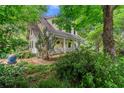 The exterior view of a charming home with lush landscaping and a welcoming front porch at 2655 Appian Way, Decatur, GA 30030