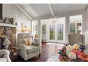 Cozy living room with a stone fireplace, plush seating, and elegant lighting at 4040 Summit Dr, Marietta, GA 30068