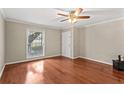 Empty bedroom with hardwood floors, a ceiling fan and a well-lit window at 1101 Collier Rd # K2, Atlanta, GA 30318