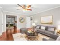Bright living room showcasing hardwood floors and comfortable seating arrangement at 1101 Collier Rd # K2, Atlanta, GA 30318