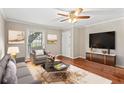 Inviting living room featuring hardwood floors, modern decor, and a ceiling fan at 1101 Collier Rd # K2, Atlanta, GA 30318