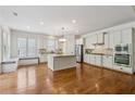 Spacious kitchen with white cabinetry, stainless steel appliances, and a central island at 4815 Westgate Drive, Cumming, GA 30040