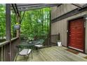 Inviting outdoor porch includes table and chairs with great view of mature trees at 504 River Run Dr, Atlanta, GA 30350