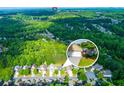Beautiful aerial view of a neighborhood with mature trees and well-kept lawns at 5251 Centennial Hill Nw Dr, Acworth, GA 30102