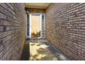 Side view of a welcoming front door in a brick facade at 5251 Centennial Hill Nw Dr, Acworth, GA 30102