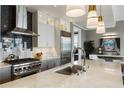 Contemporary kitchen featuring an island, stainless appliances, and sleek countertops at 58 Canton St # 410, Alpharetta, GA 30009