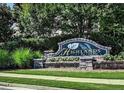 The Highlands at Duluth community sign surrounded by lush greenery and landscaping at 3943 Ridge Grove Way, Suwanee, GA 30024