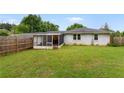 Large, flat backyard featuring a screened-in porch for outdoor relaxation and entertainment at 2221 Shallowford Rd, Marietta, GA 30066