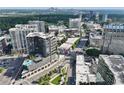 Aerial view of the building and surrounding neighborhood showcasing the city skyline and green spaces at 3107 Peachtree Ne Rd # 1005, Atlanta, GA 30305