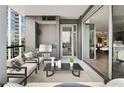 Relax on this expansive balcony with a seating area and outdoor grill, perfect for entertaining at 3107 Peachtree Ne Rd # 1005, Atlanta, GA 30305