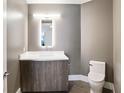 Modern half bathroom featuring a stylish vanity, mirror with LED lighting, and toilet at 3107 Peachtree Ne Rd # 1005, Atlanta, GA 30305