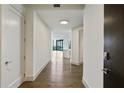 Inviting hallway showcasing hardwood floors and neutral color palette leading to open living area at 3107 Peachtree Ne Rd # 1005, Atlanta, GA 30305