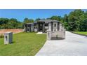 Attractive home with manicured lawn, modern design, and elegant brick mailbox and entry features at 972 Auburn Rd, Dacula, GA 30019