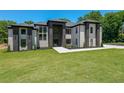 Stunning two-story home featuring modern architectural details, well-kept lawn, and professional landscaping at 972 Auburn Rd, Dacula, GA 30019