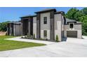 Beautiful home with a side-entry garage, manicured landscaping, and a modern brick design at 972 Auburn Rd, Dacula, GA 30019